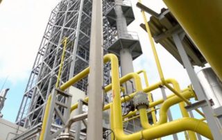 Oil Refinery with yellow and grey pipes