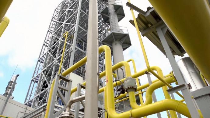 Oil Refinery with yellow and grey pipes