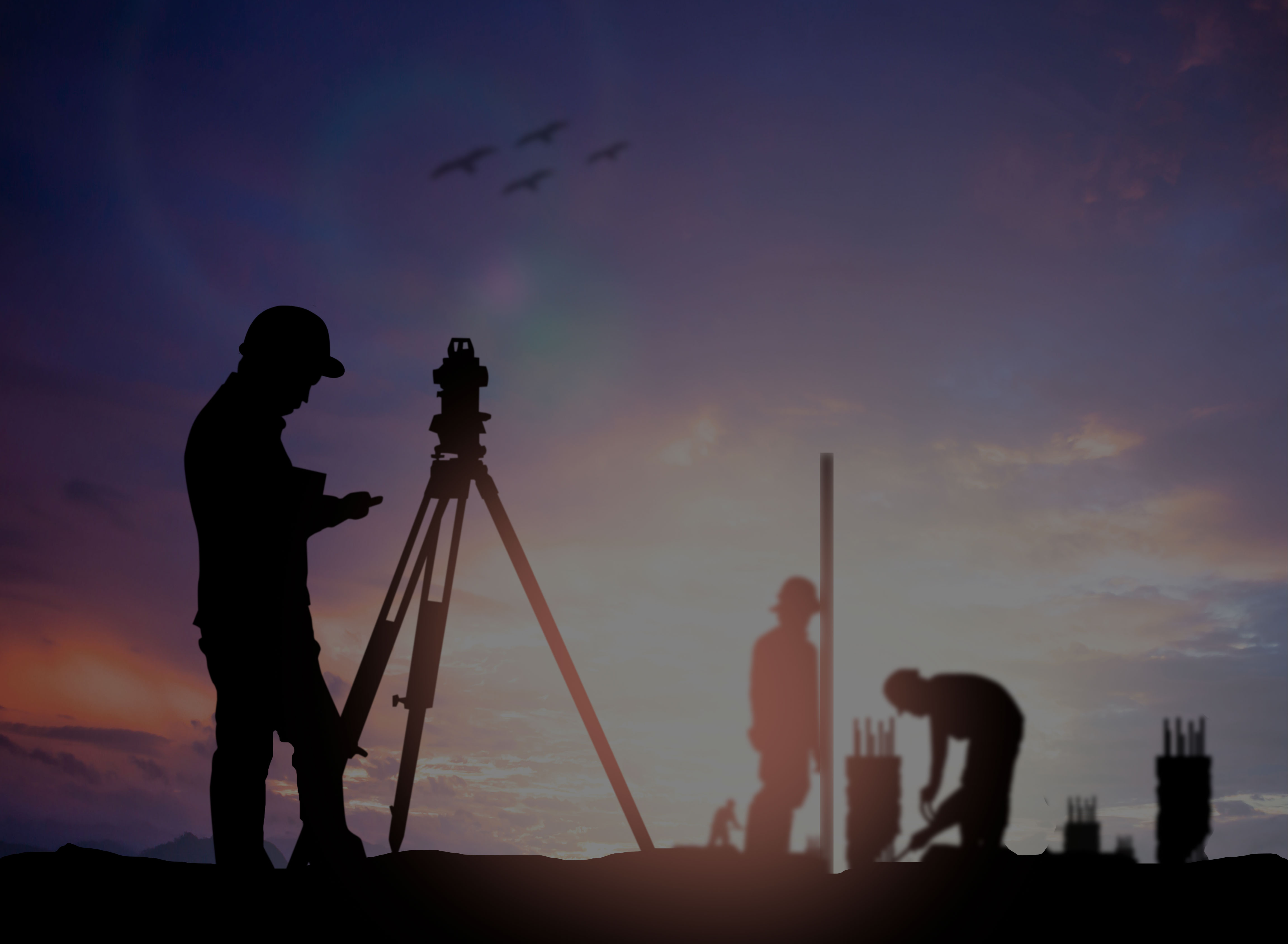 Civil engineer surveying construction site