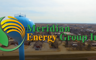 Meridian Energy Group Inc. Logo over Belfield, North Dakota