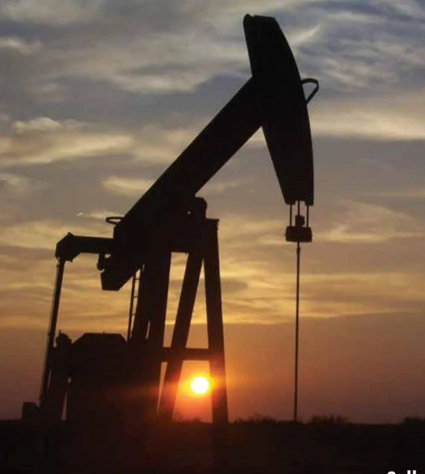 Oil pumpjack at sunset